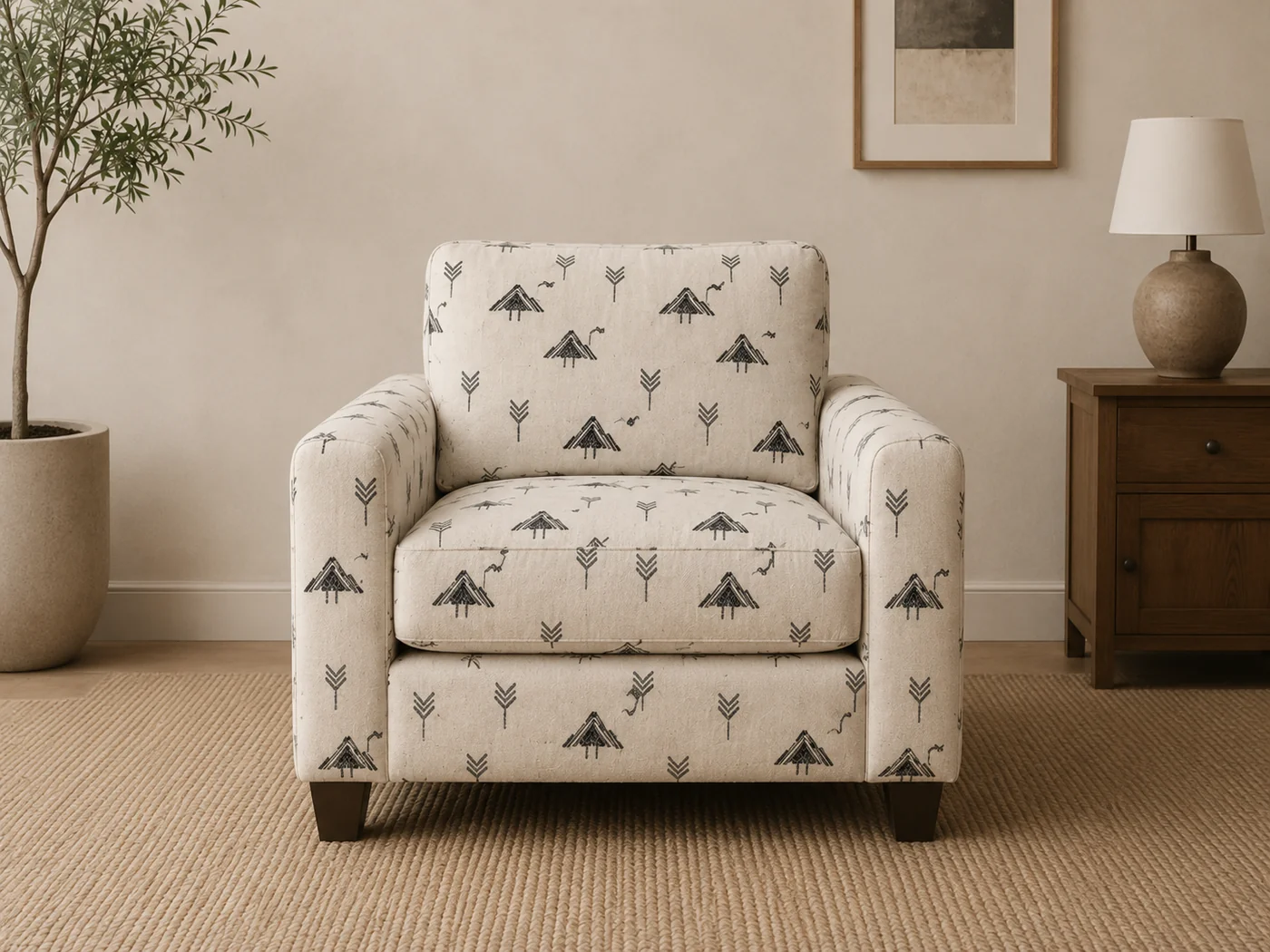 Sofa upholstered in a cream jacquard fabric with a folk-art bird and geometric motif